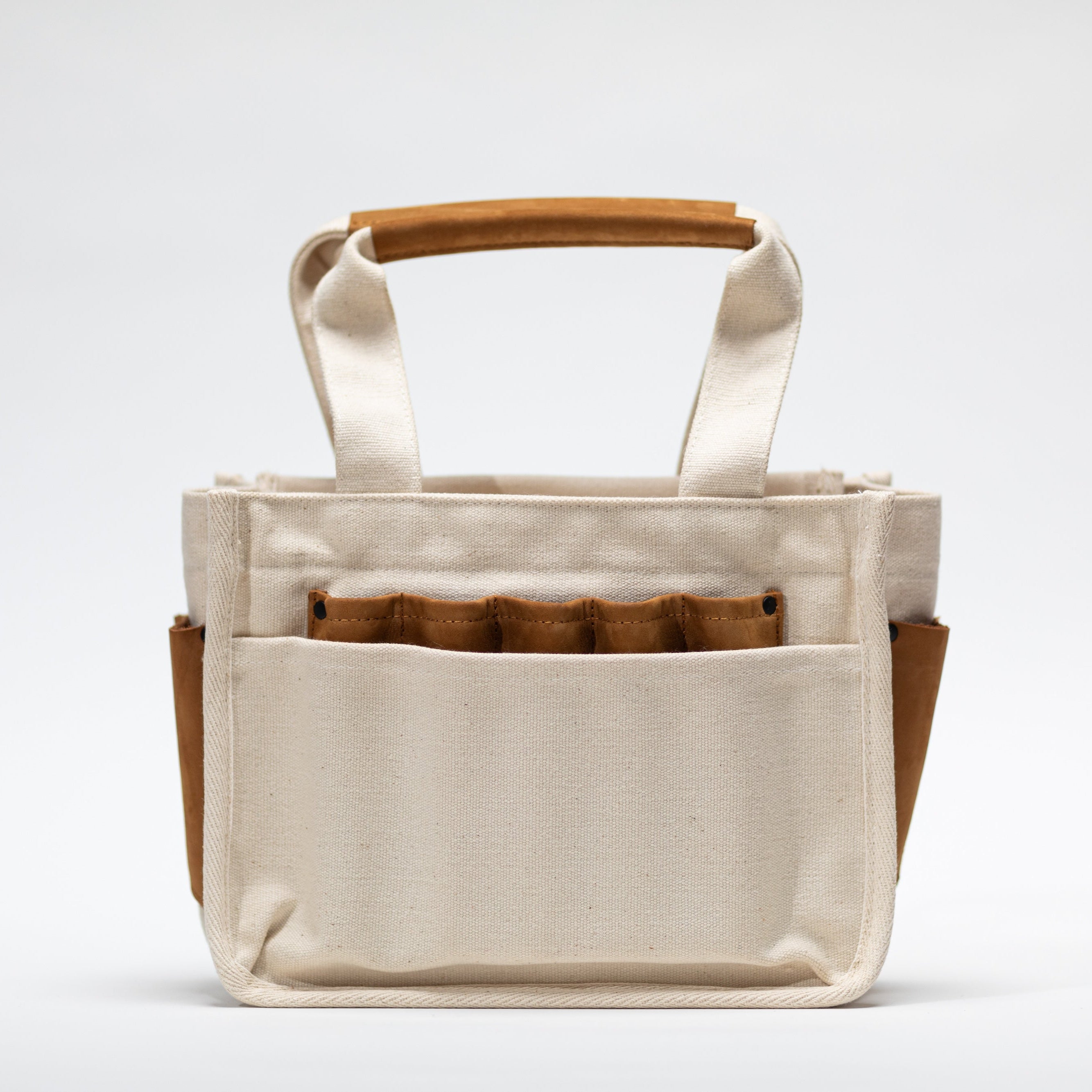 Monkey Stuff pottery tool bag — recycled cotton canvas and leather construction with multiple compartments for pottery tools