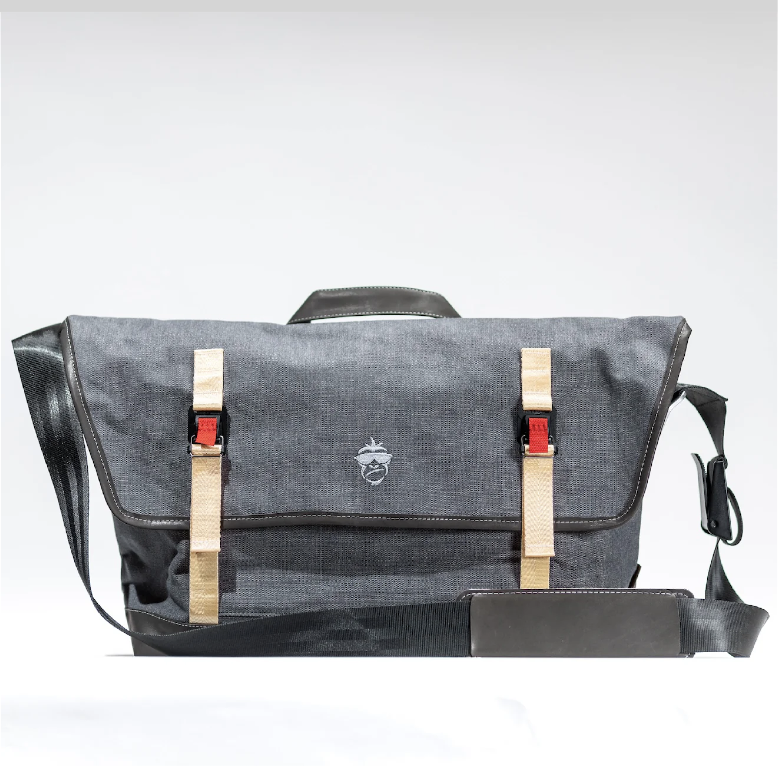 
Monkey Stuff messenger bag — handmade recycled canvas and leather bag with shoulder strap and brass hardware